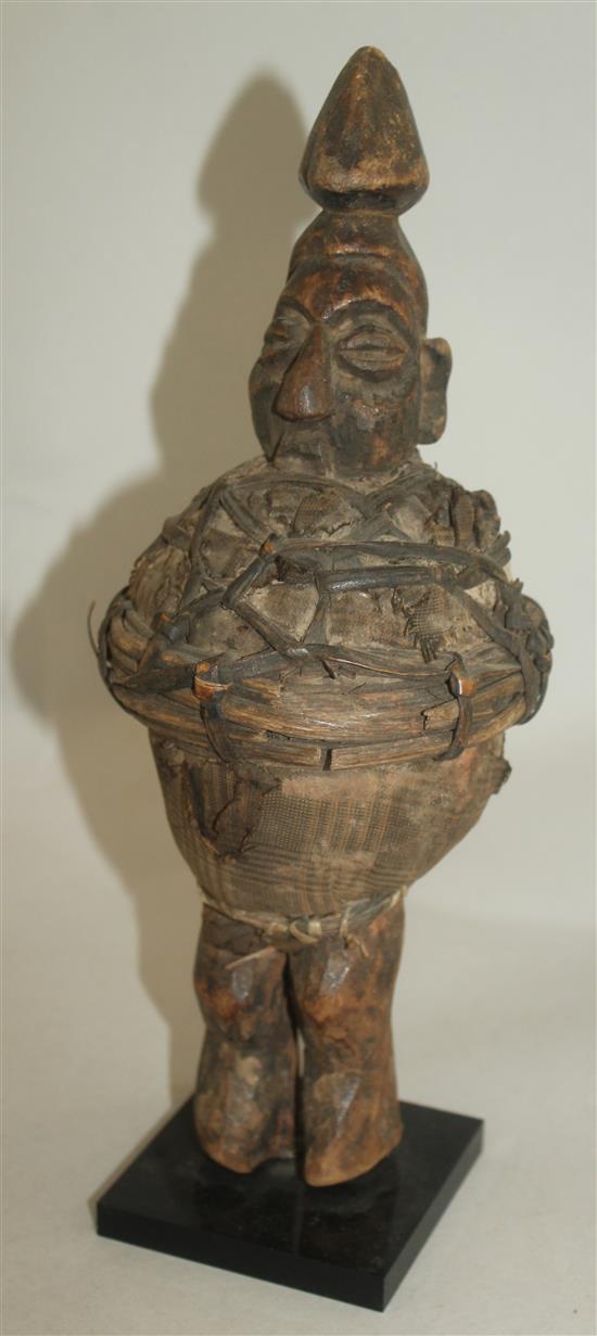 An African Ivory Coast Baule figure of a standing male, largest figure 20.5in.